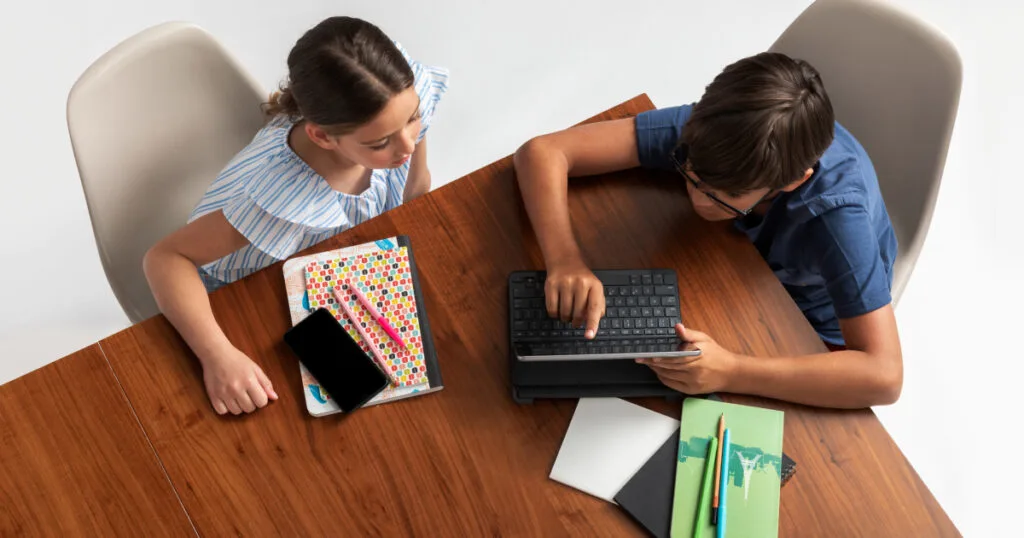 Two children using tablet.